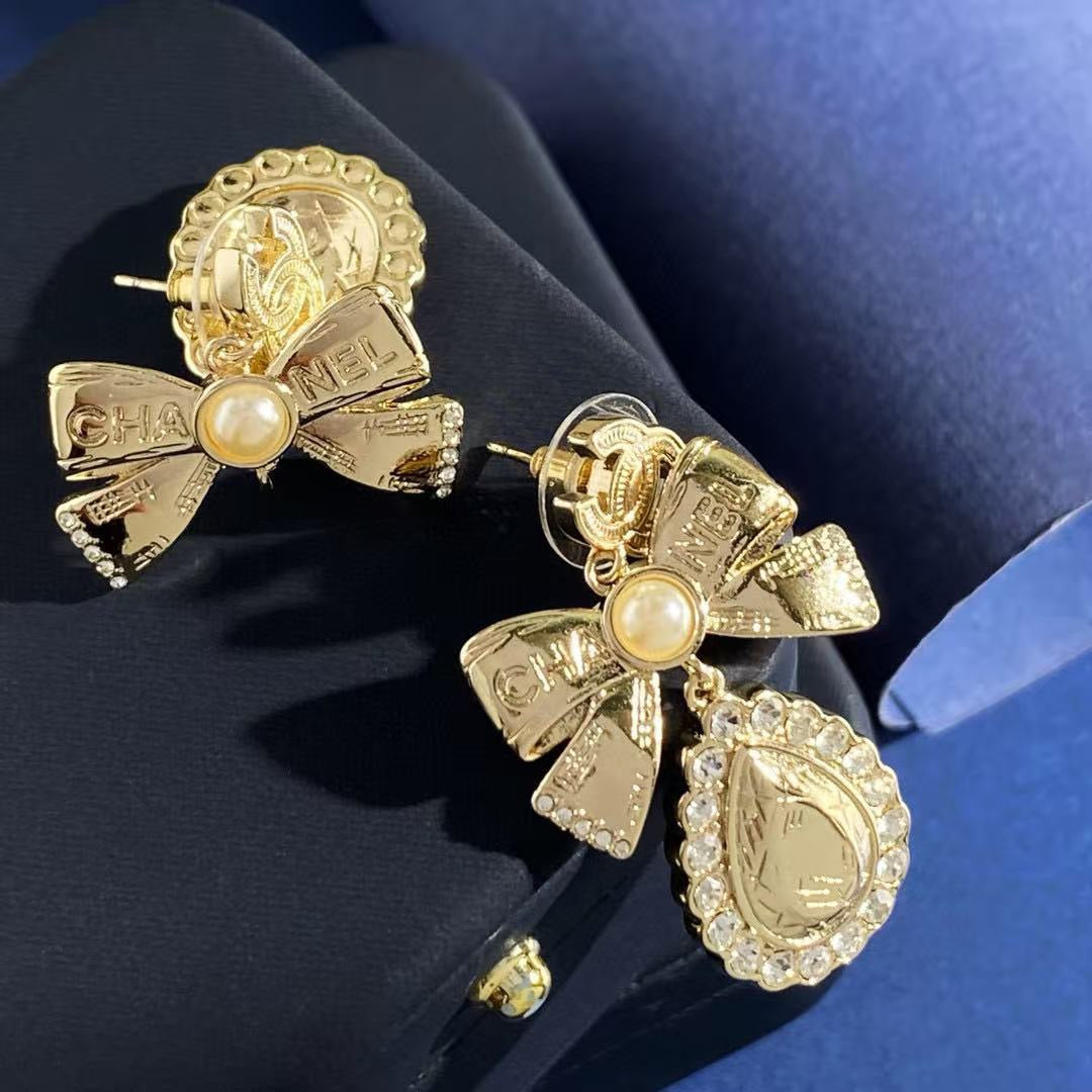 Martin Graham stud earrings in polished metal-tone – styled product view