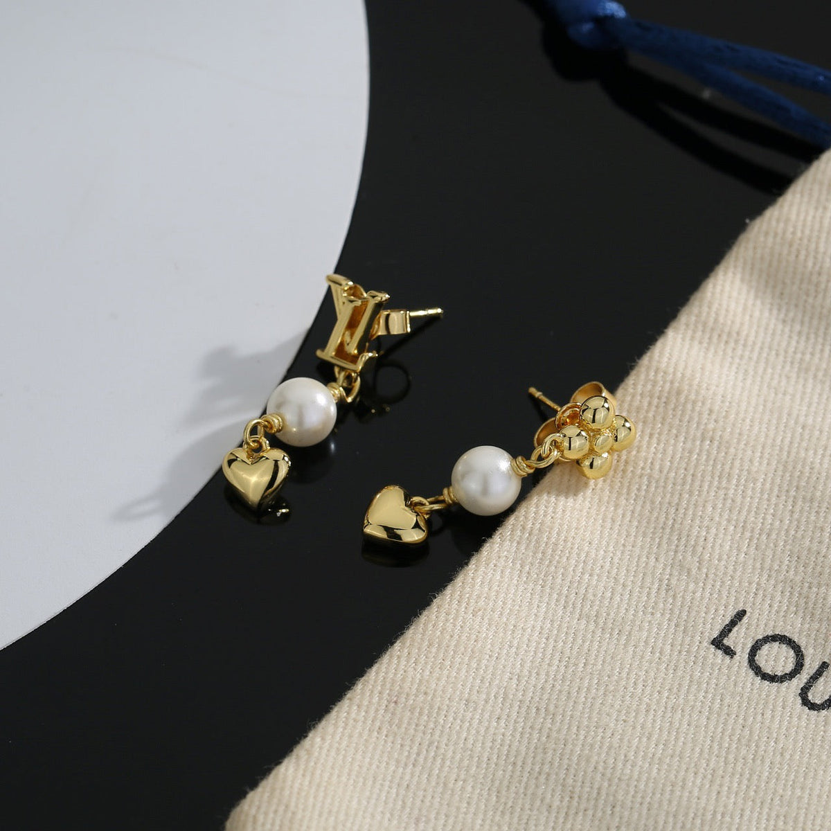 Martin Graham stud earrings in polished metal-tone – styled product view