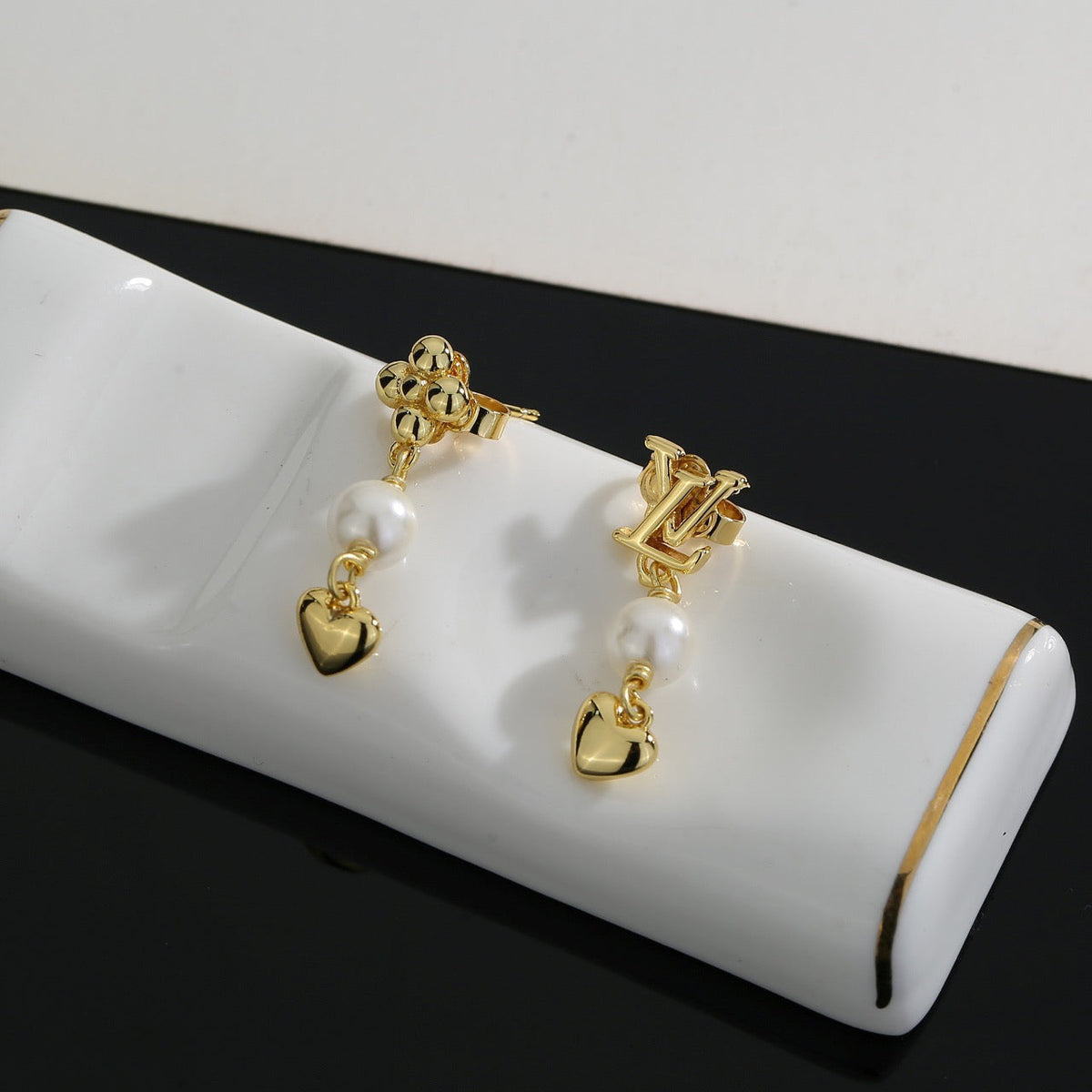 Martin Graham stud earrings in polished metal-tone – main product view