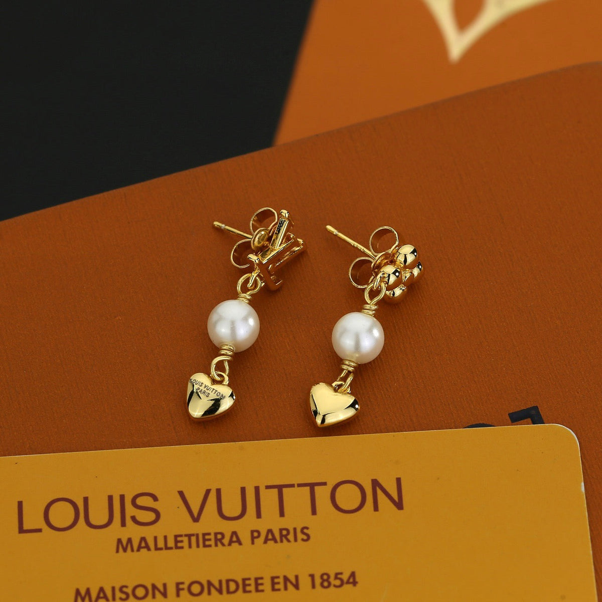 Martin Graham stud earrings in polished metal-tone – side detail
