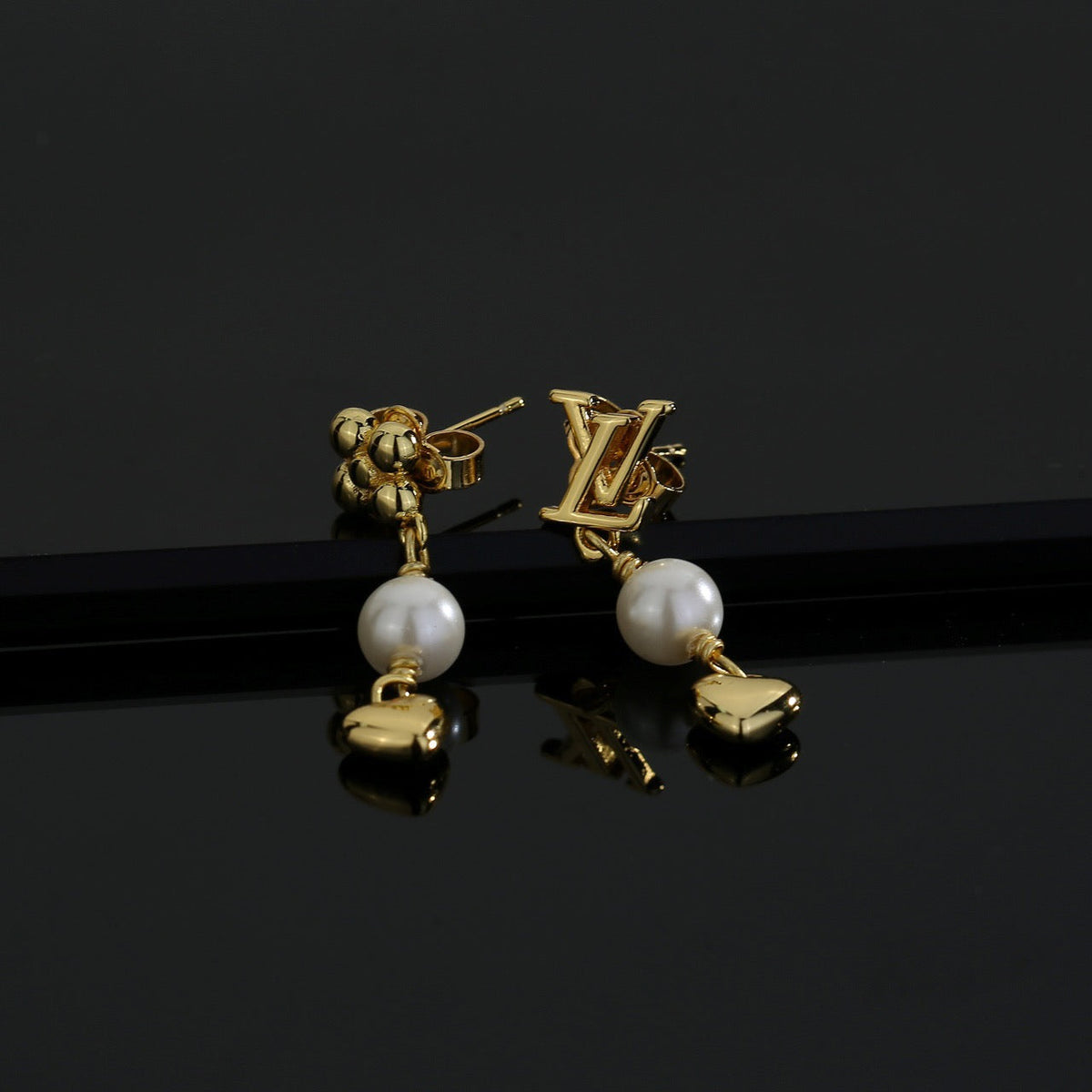 Martin Graham stud earrings in polished metal-tone – front product view