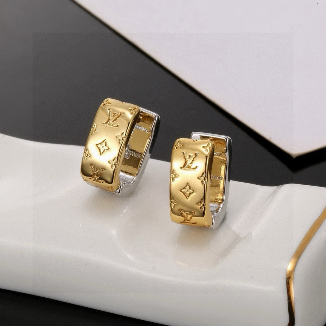 Martin Graham stud earrings in polished metal-tone – close-up detail