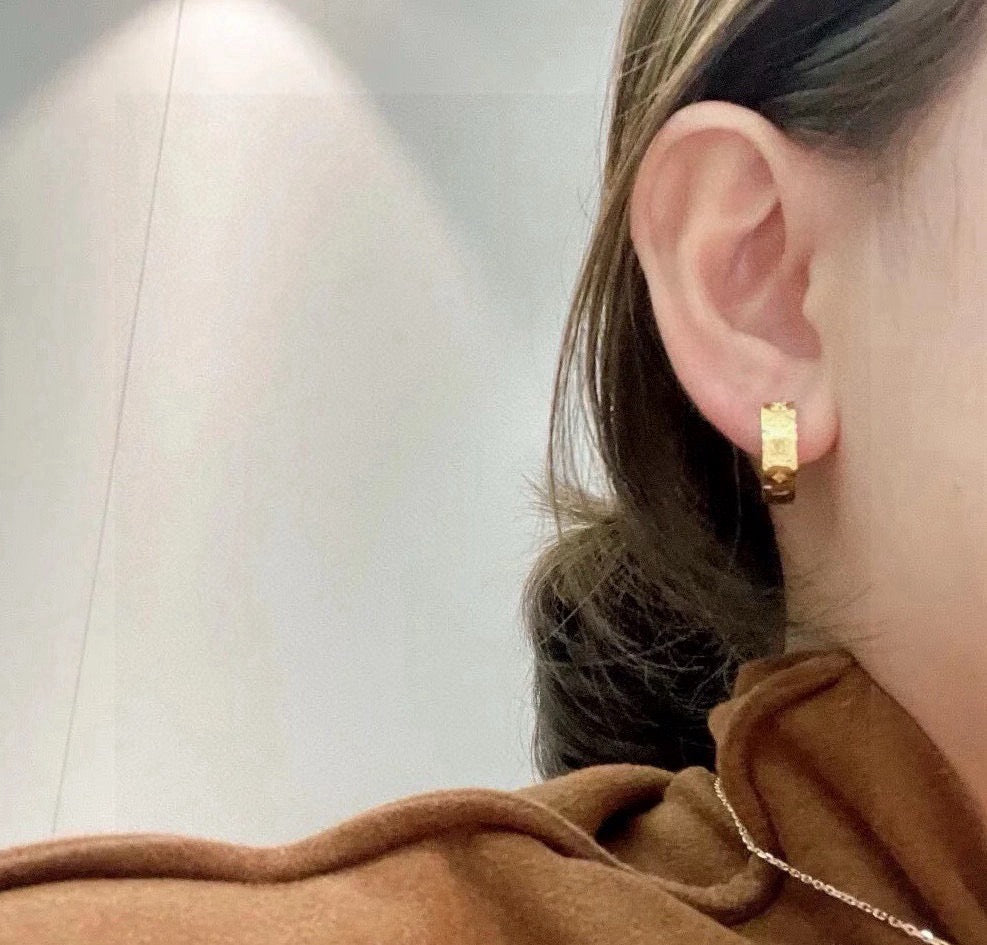 Martin Graham stud earrings in polished metal-tone – styled product view