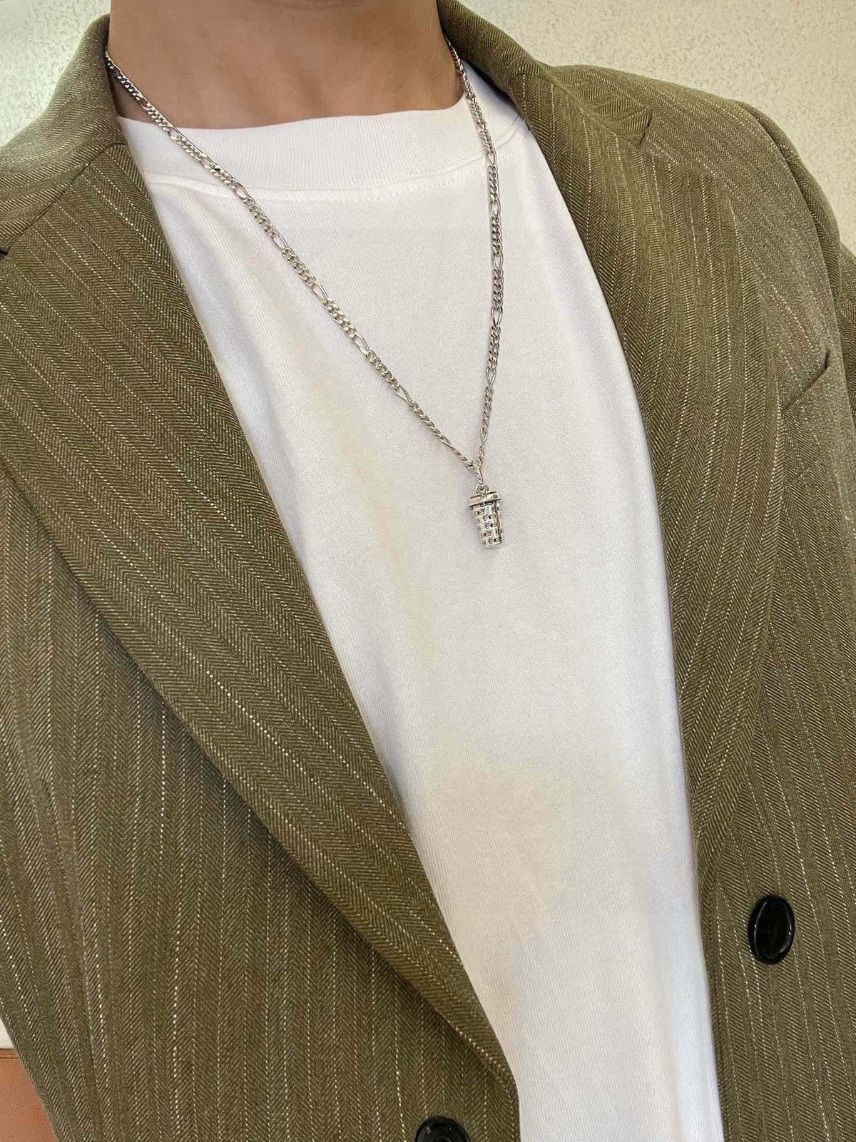 Martin Graham pendant necklace in polished metal-tone – detail view