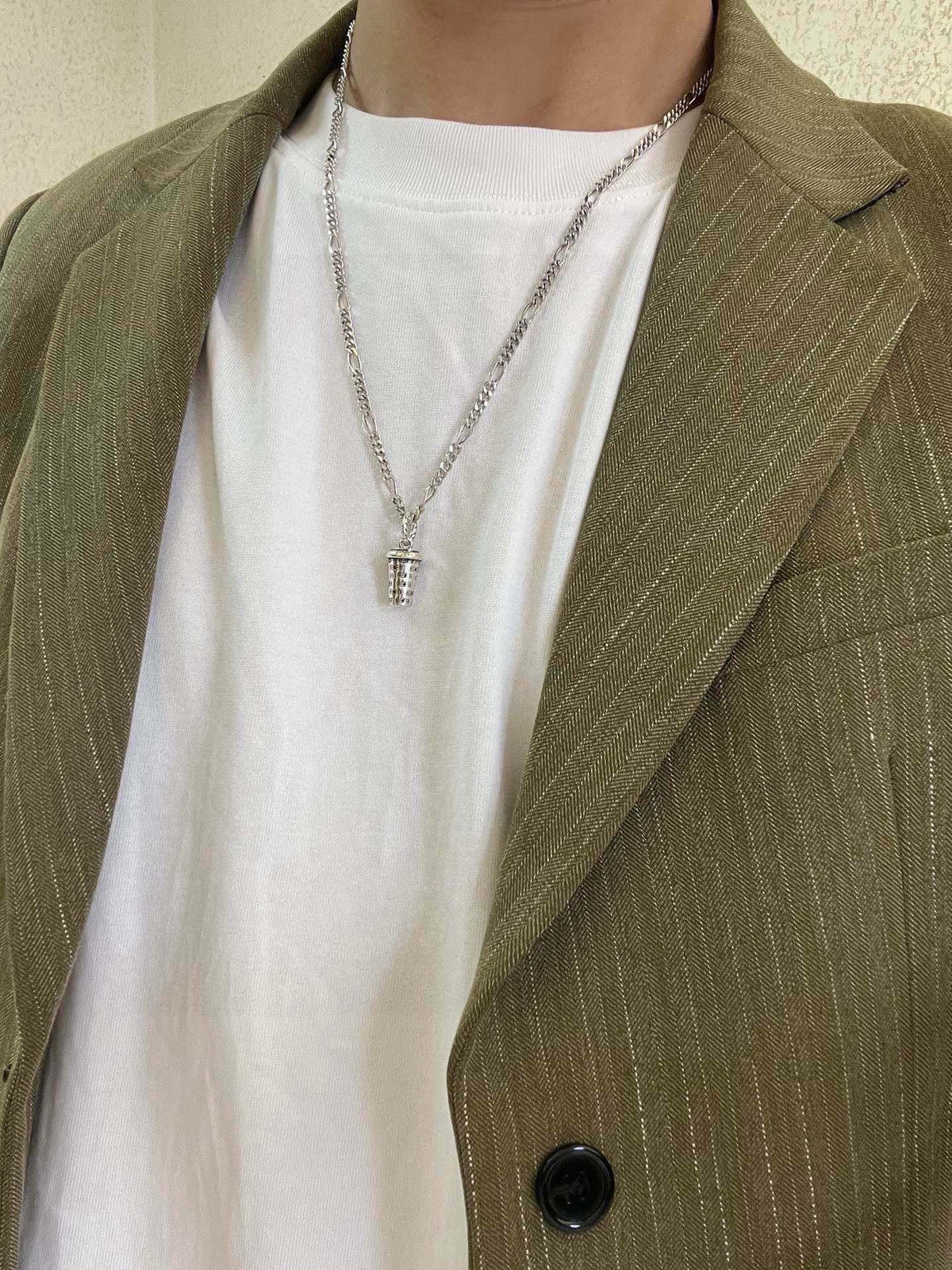 Martin Graham pendant necklace in polished metal-tone – detail view