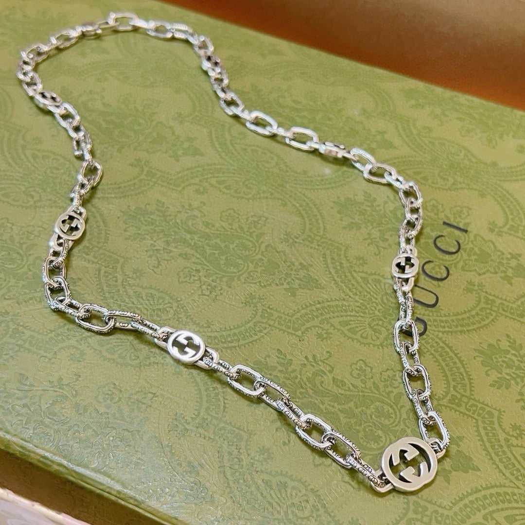 Martin Graham pendant necklace in polished metal-tone – front product view