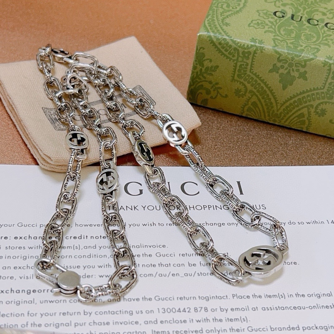 Martin Graham pendant necklace in polished metal-tone – close-up detail