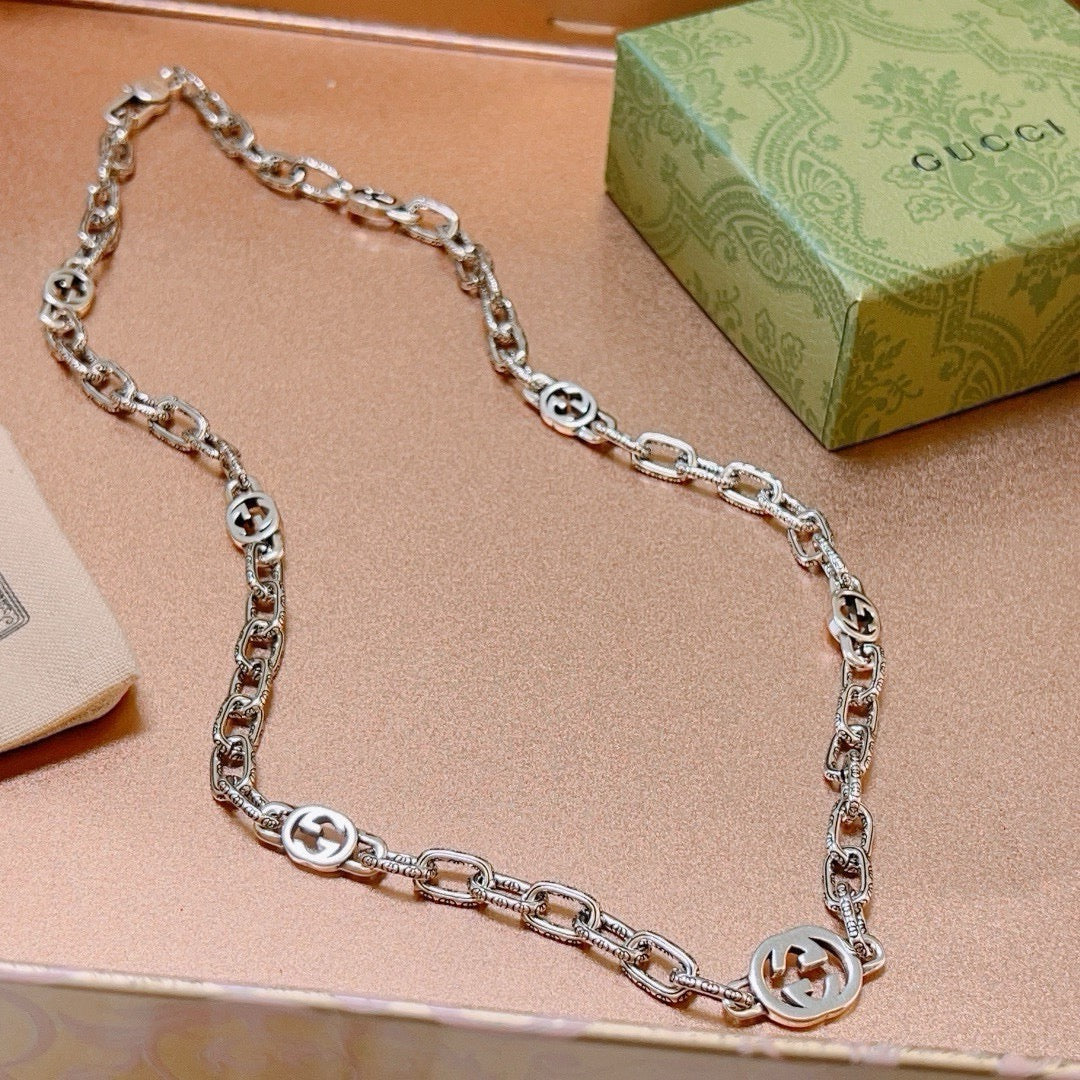 Martin Graham pendant necklace in polished metal-tone – side detail