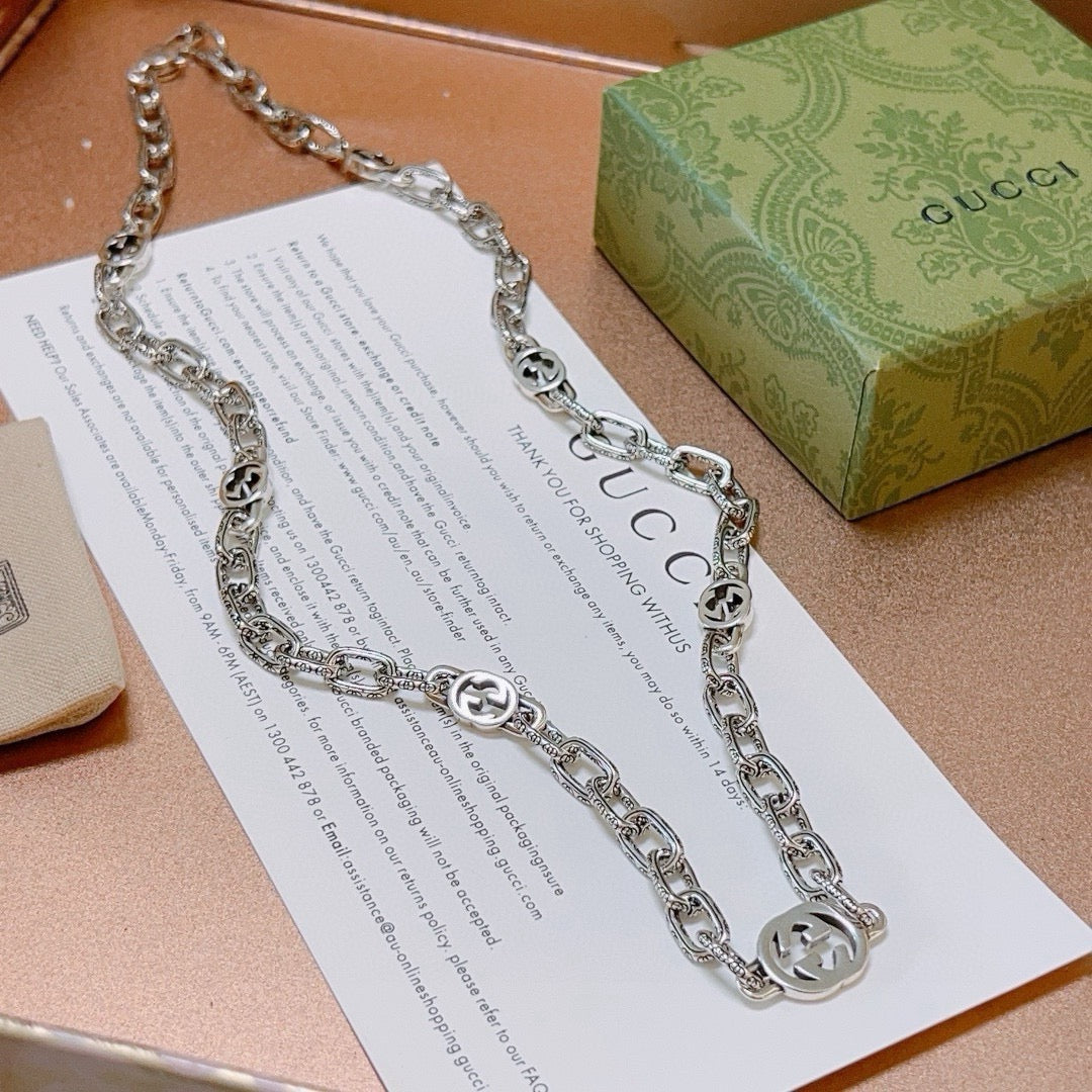 Martin Graham pendant necklace in polished metal-tone – front product view