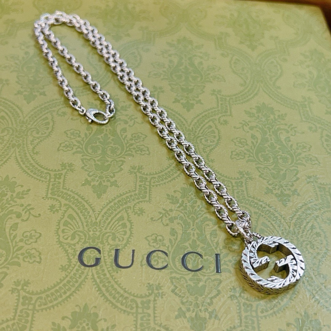 Martin Graham pendant necklace in polished metal-tone – front product view