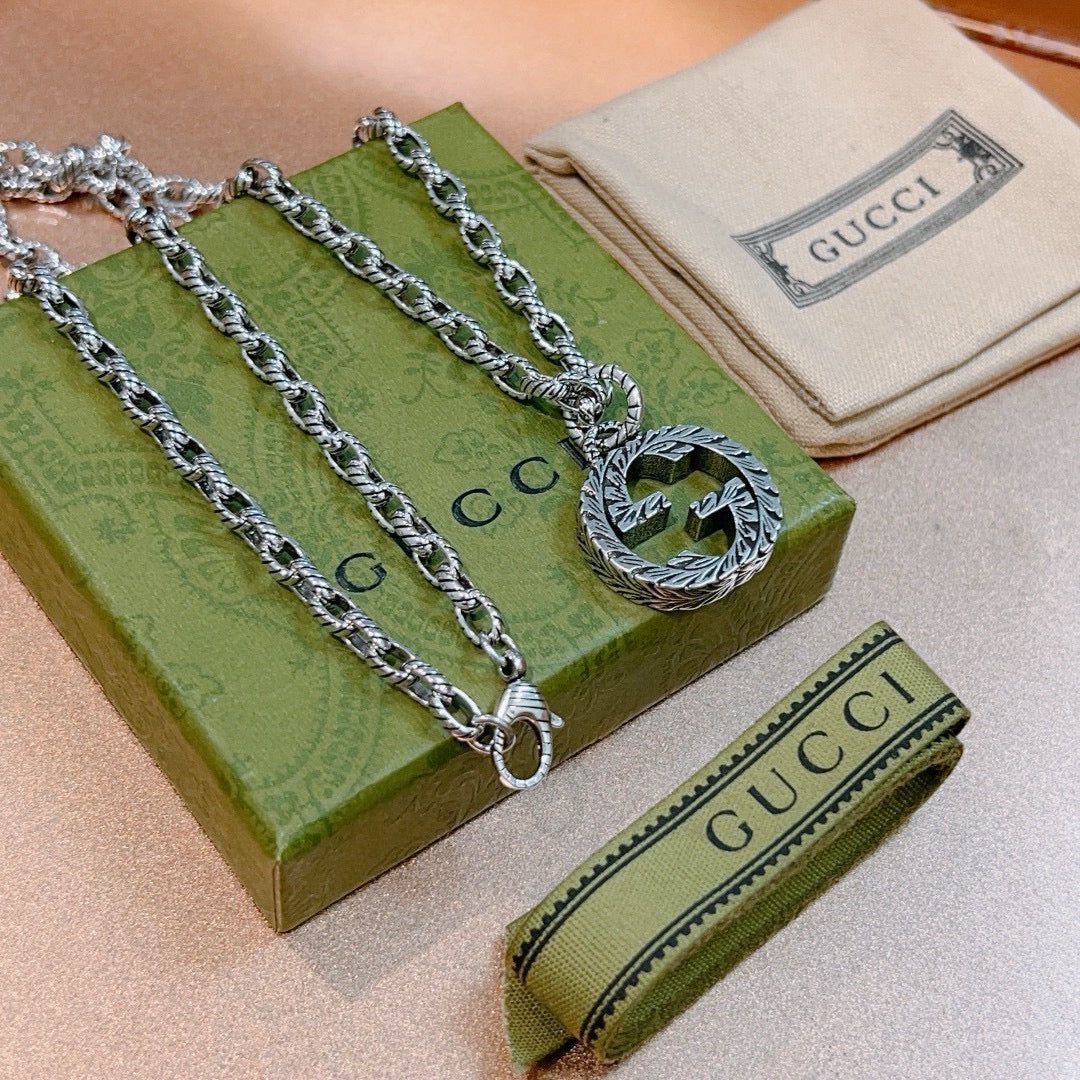 Martin Graham pendant necklace in polished metal-tone – detail view
