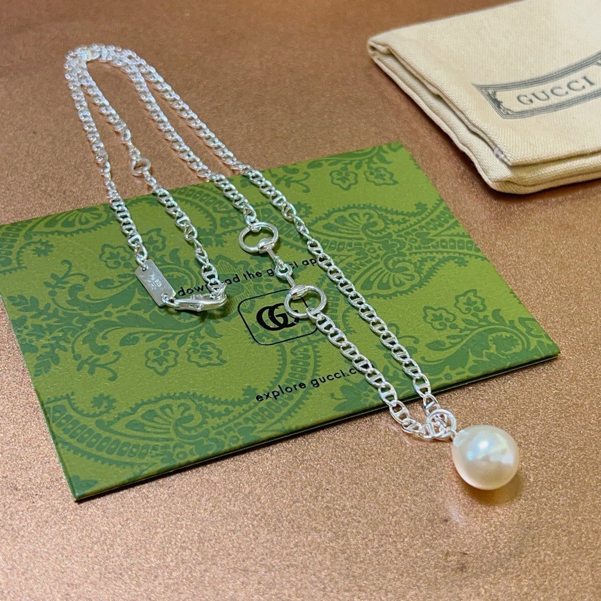 Martin Graham pendant necklace in polished metal-tone – side detail
