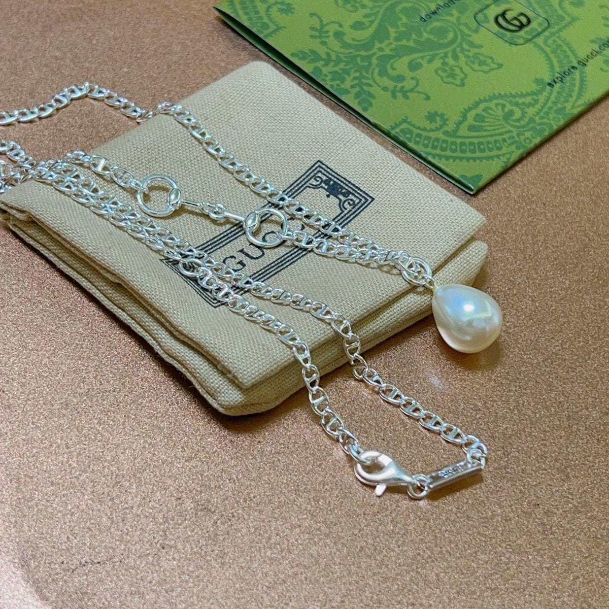 Martin Graham pendant necklace in polished metal-tone – close-up detail