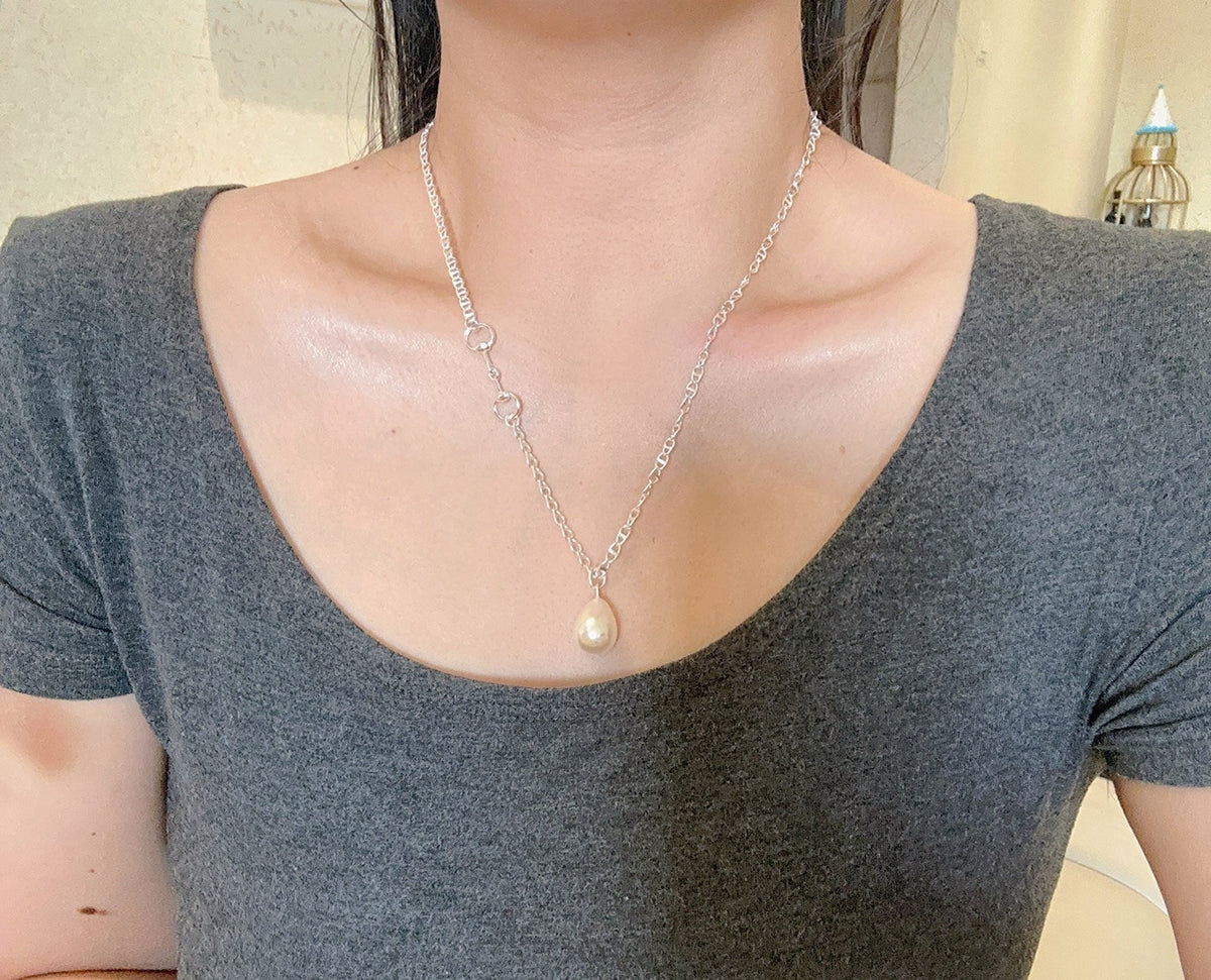 Martin Graham pendant necklace in polished metal-tone – detail view