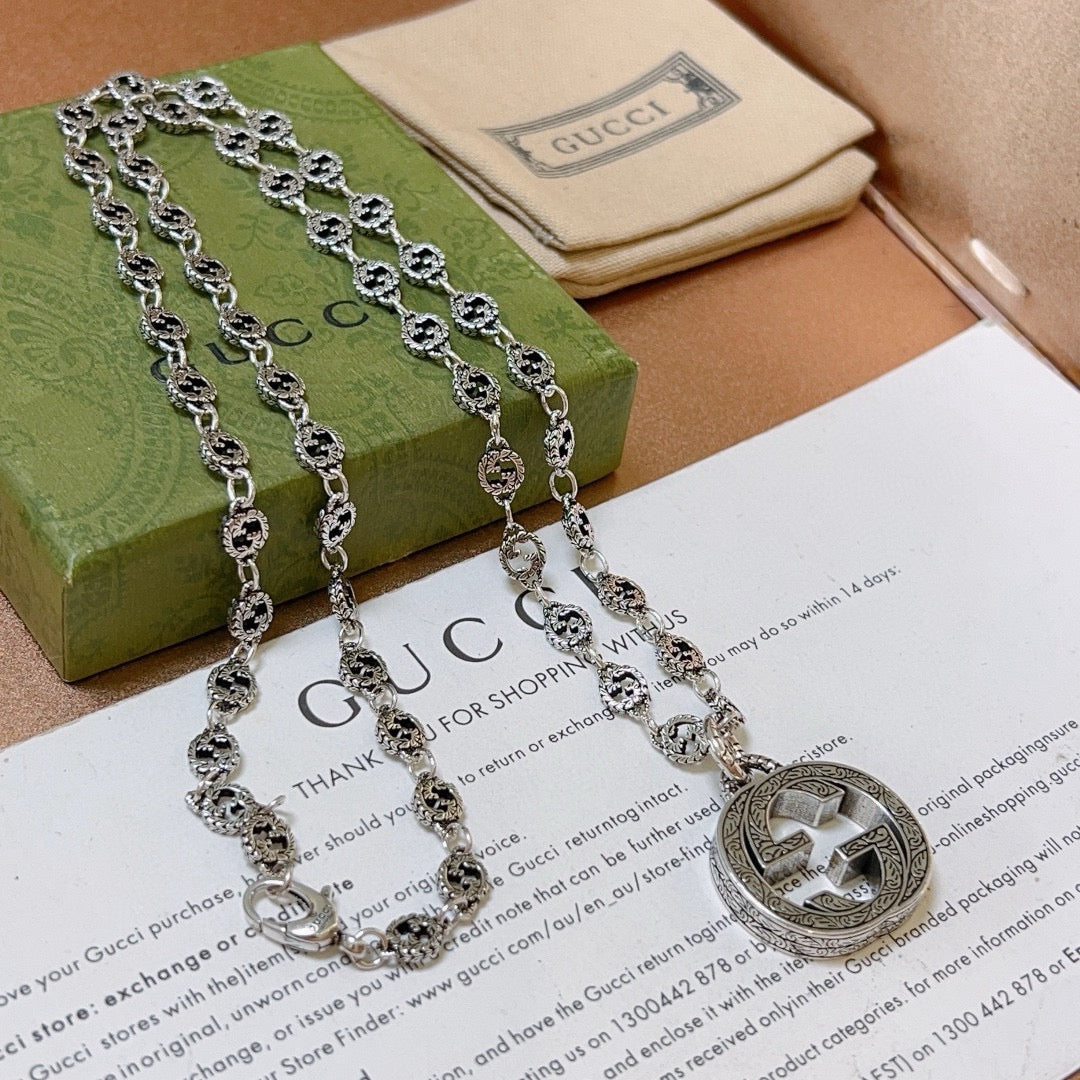 Martin Graham pendant necklace in polished metal-tone – side detail