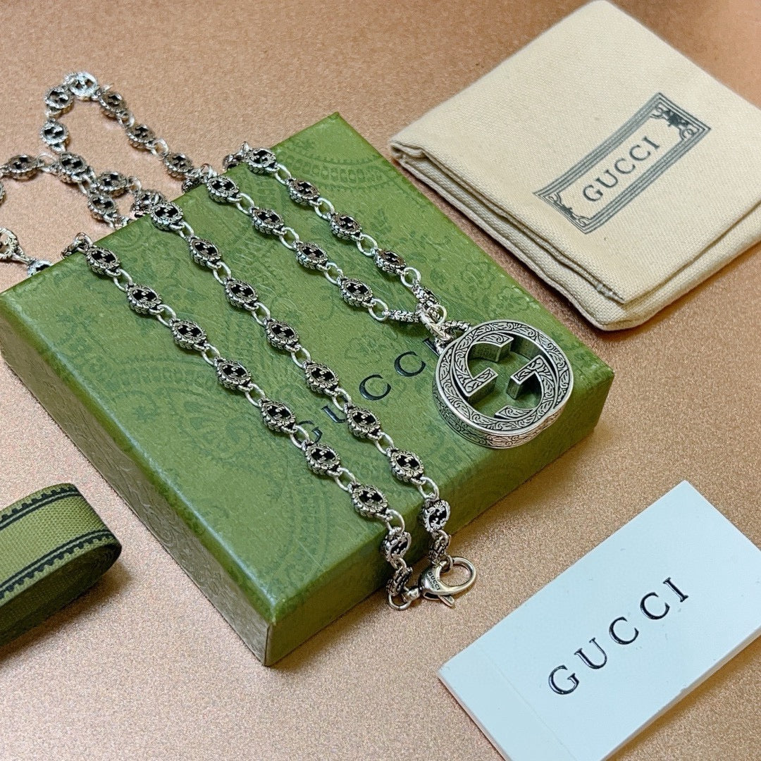 Martin Graham pendant necklace in polished metal-tone – front product view