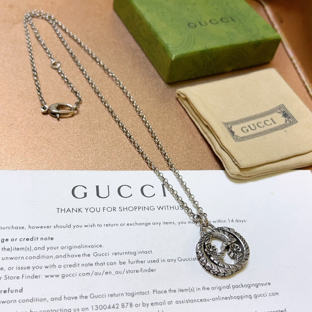 Martin Graham pendant necklace in polished metal-tone – side detail
