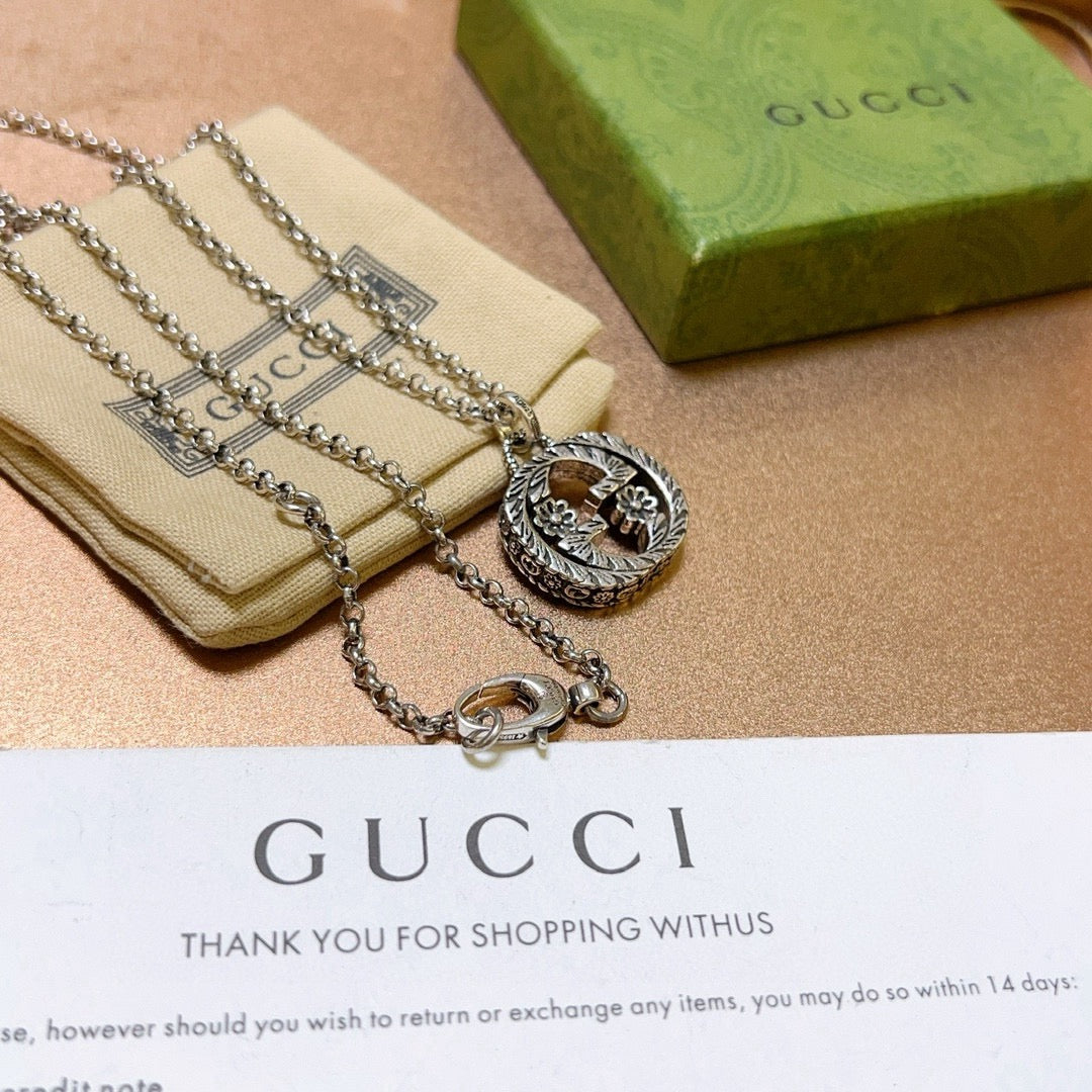 Martin Graham pendant necklace in polished metal-tone – close-up detail