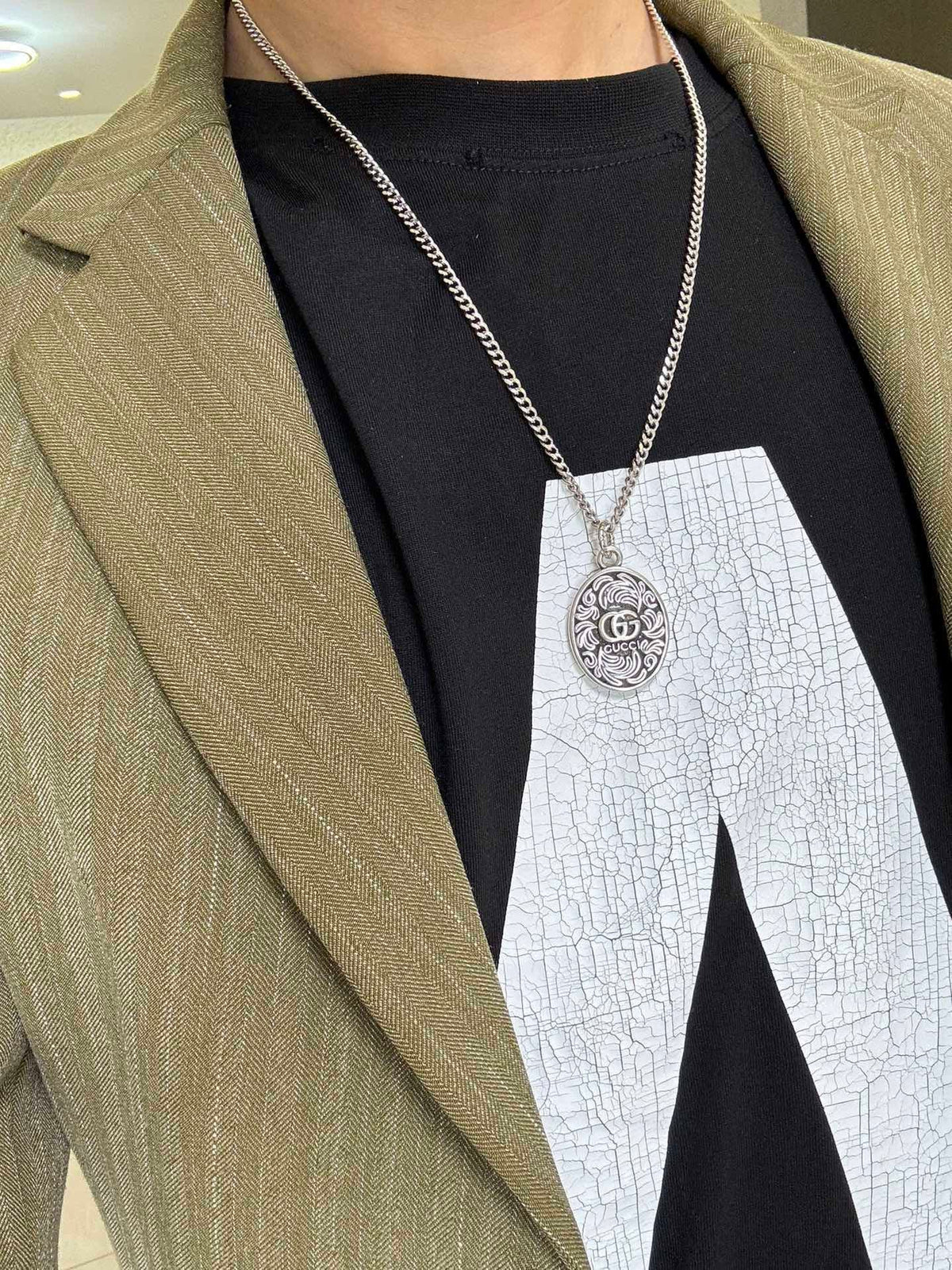 Martin Graham pendant necklace in polished metal-tone – detail view