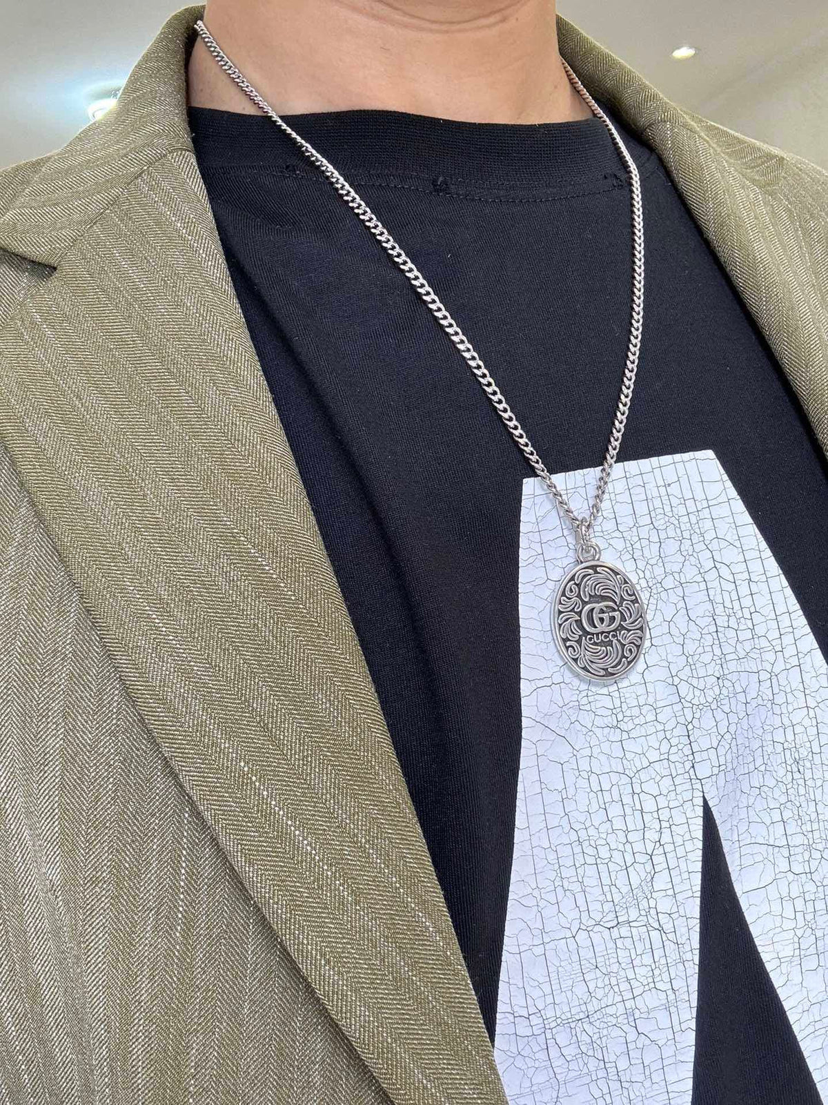 Martin Graham pendant necklace in polished metal-tone – detail view