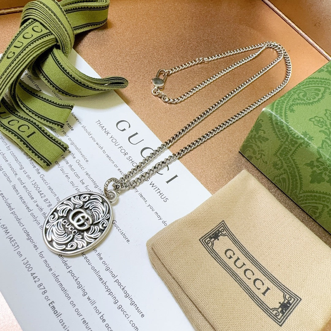 Martin Graham pendant necklace in polished metal-tone – front product view