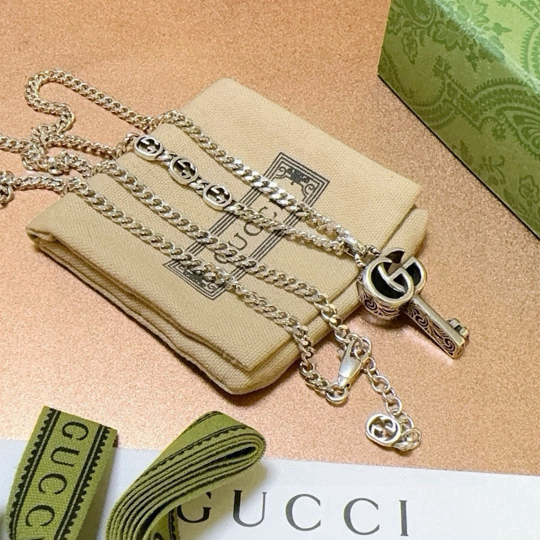 Martin Graham pendant necklace in polished metal-tone – front product view