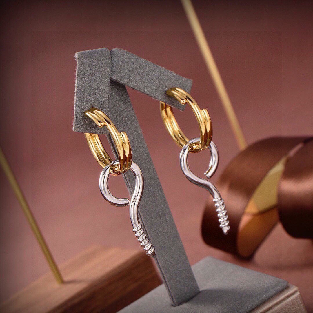 Martin Graham earrings in polished metal-tone – close-up detail