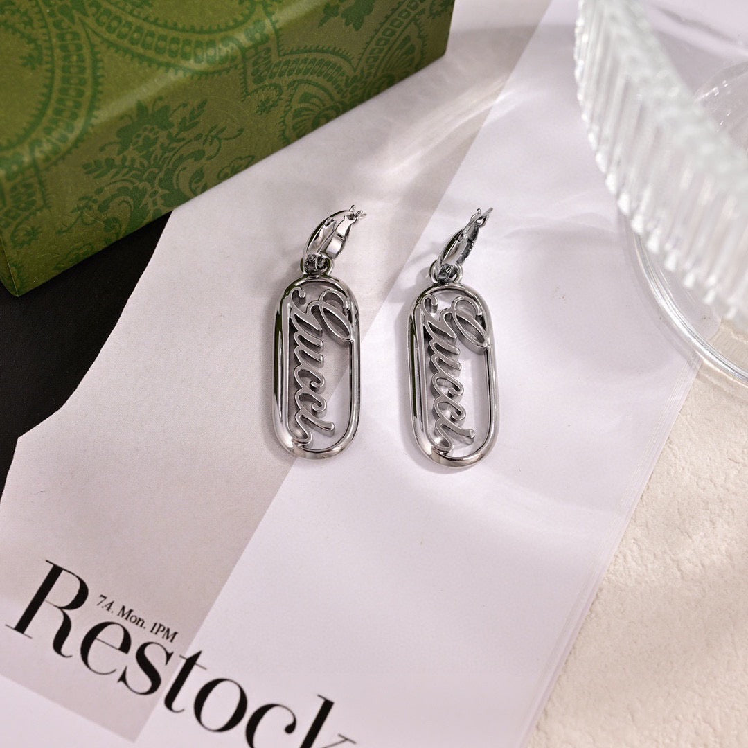Martin Graham stud earrings in polished metal-tone – main product view