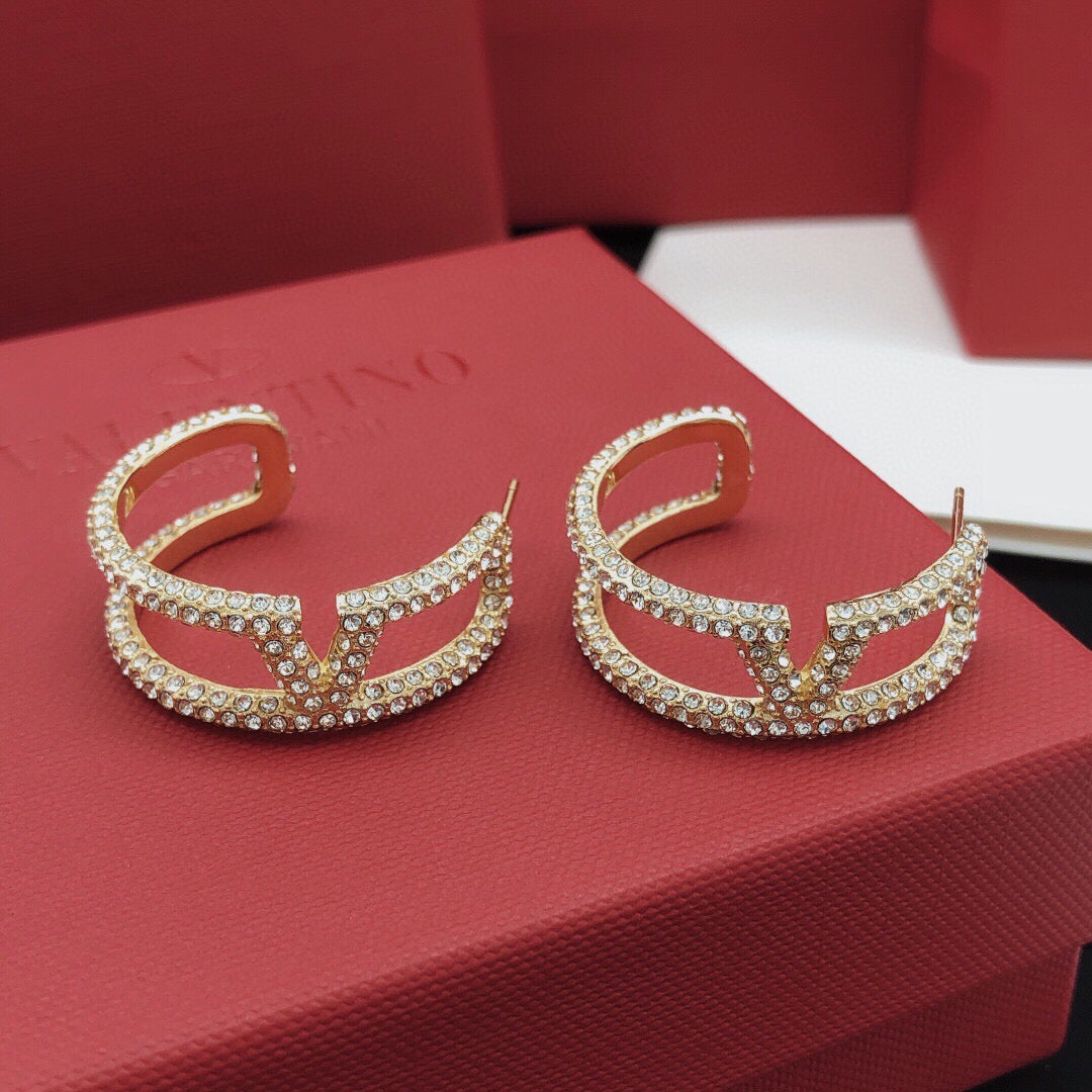 Martin Graham earrings in polished metal-tone