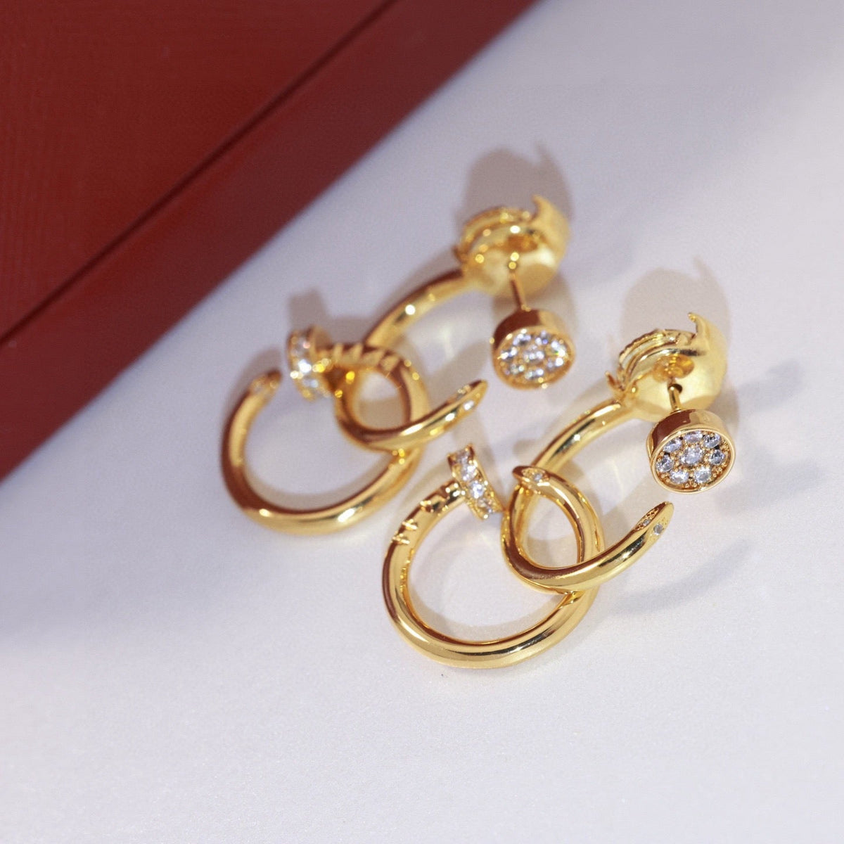 Martin Graham stud earrings in polished metal-tone – main product view