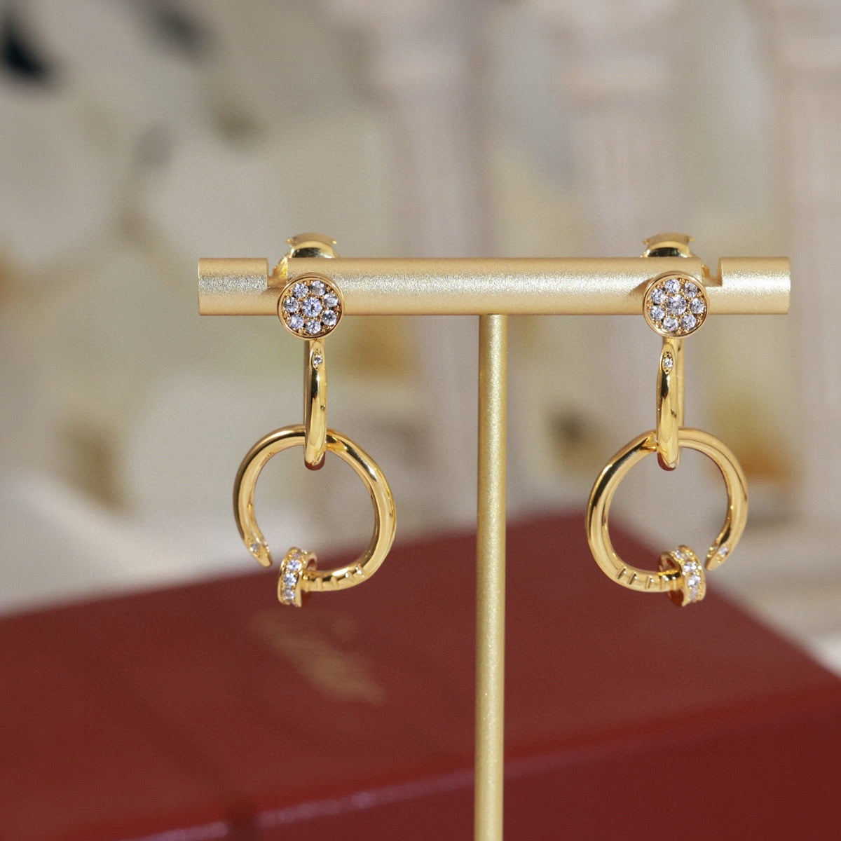 Martin Graham stud earrings in polished metal-tone – side detail