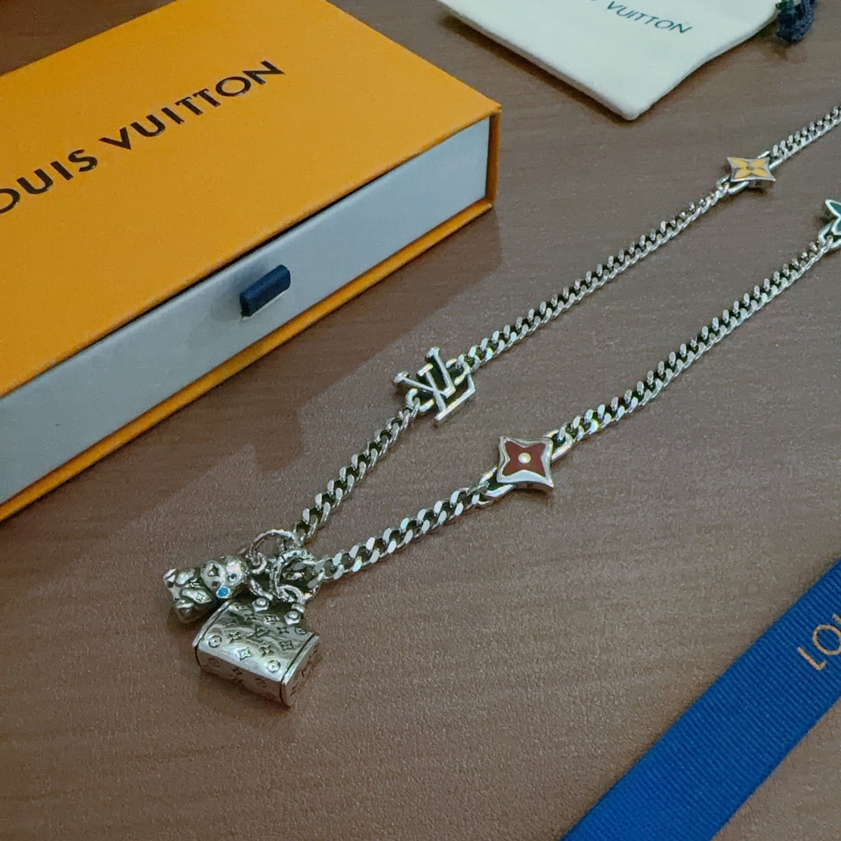 Martin Graham pendant necklace in polished metal-tone – close-up detail