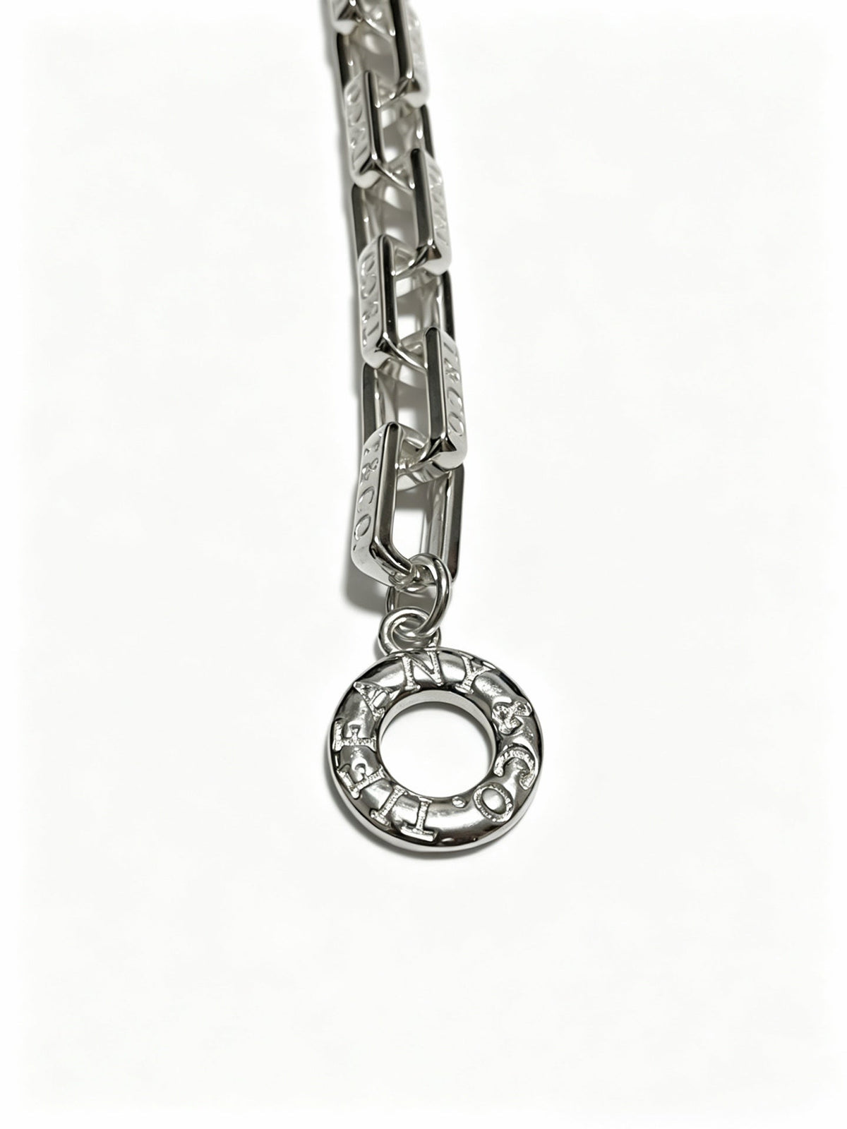 Martin Graham pendant necklace in polished metal-tone – close-up detail