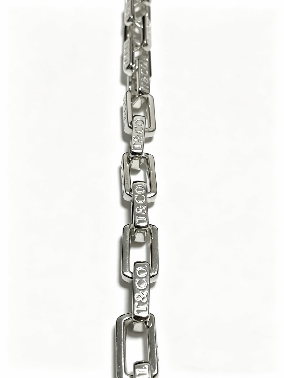 Martin Graham pendant necklace in polished metal-tone – side detail