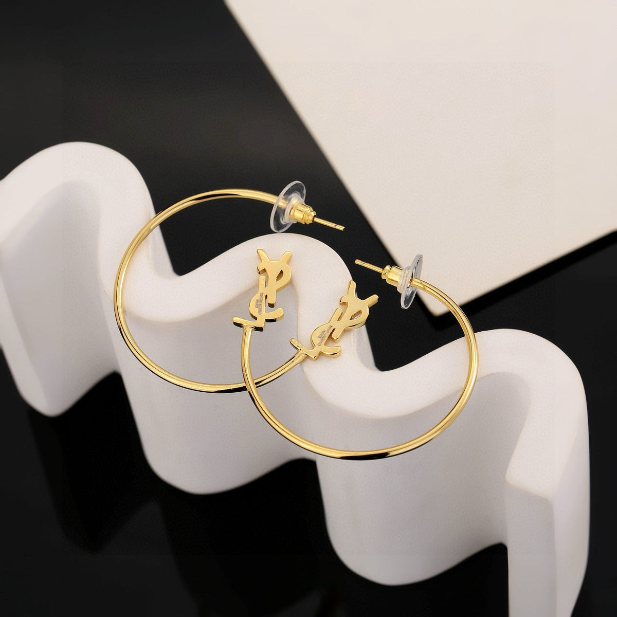 Martin Graham stud earrings in polished metal-tone – main product view