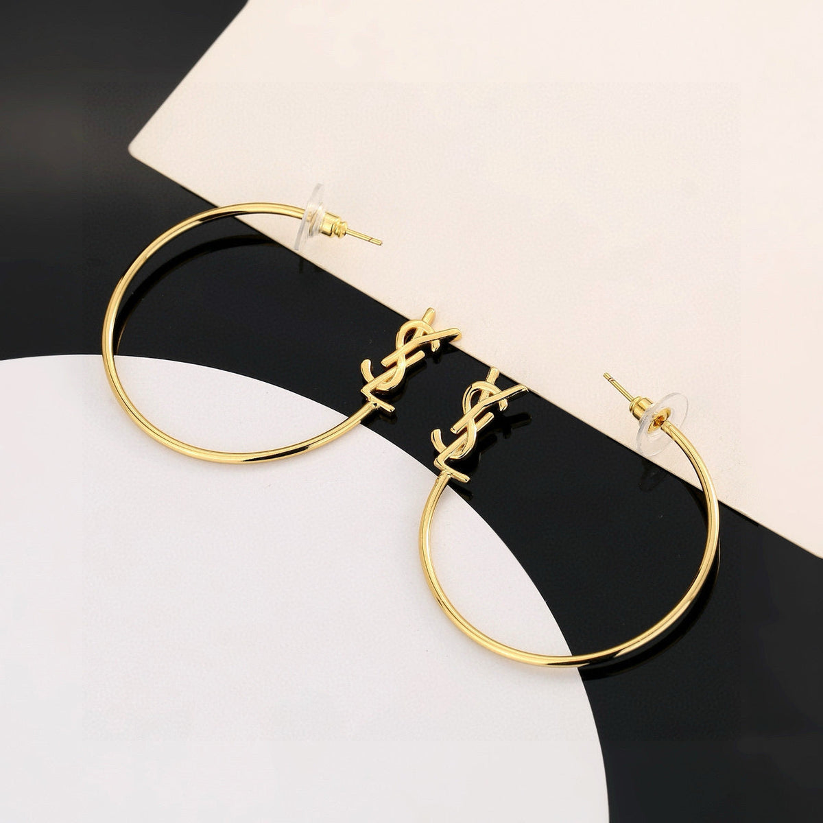 Martin Graham stud earrings in polished metal-tone – front product view