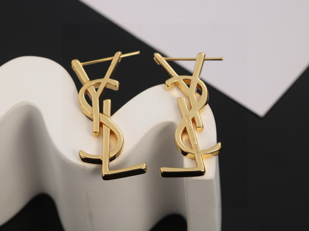 Martin Graham stud earrings in polished metal-tone – close-up detail