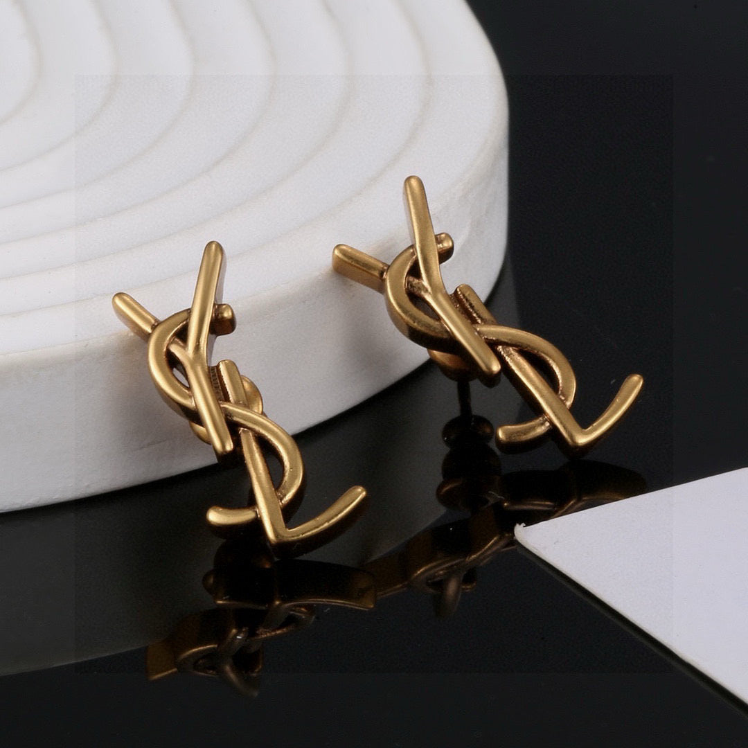 Martin Graham stud earrings in polished metal-tone – detail view