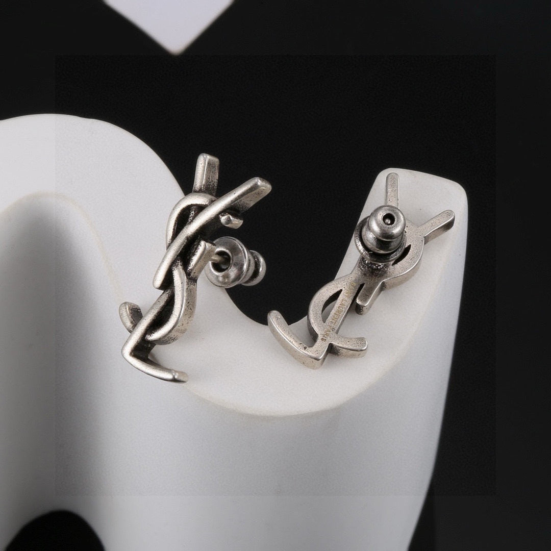 Martin Graham stud earrings in polished metal-tone – styled product view