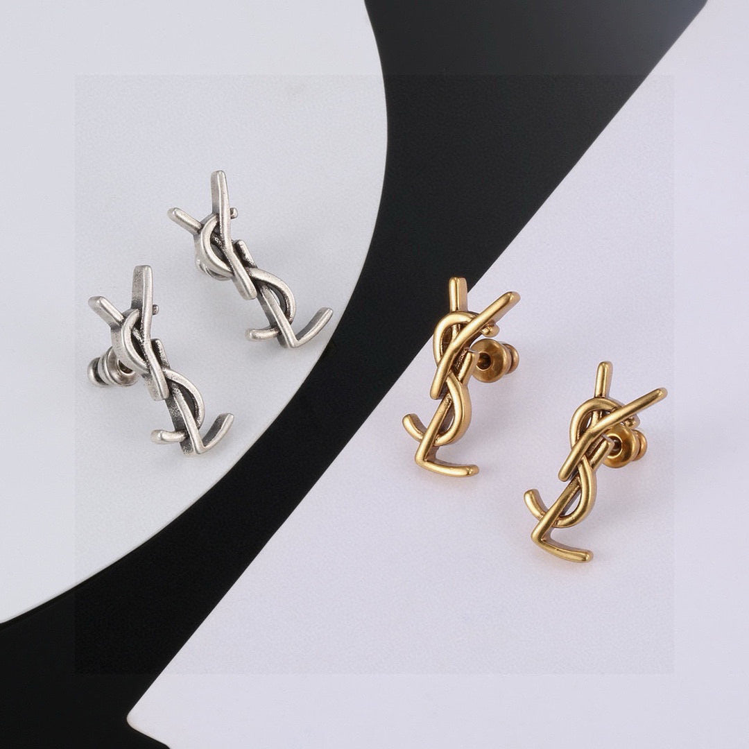 Martin Graham stud earrings in polished metal-tone – close-up detail