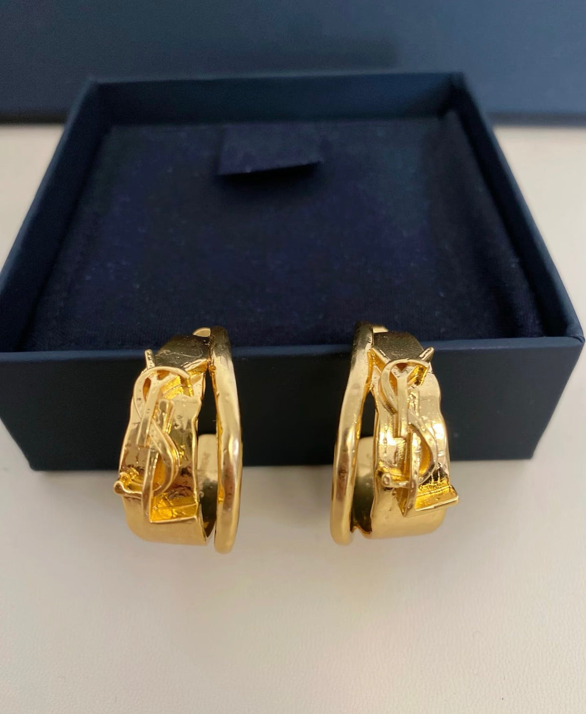 Martin Graham earrings in polished metal-tone – front product view