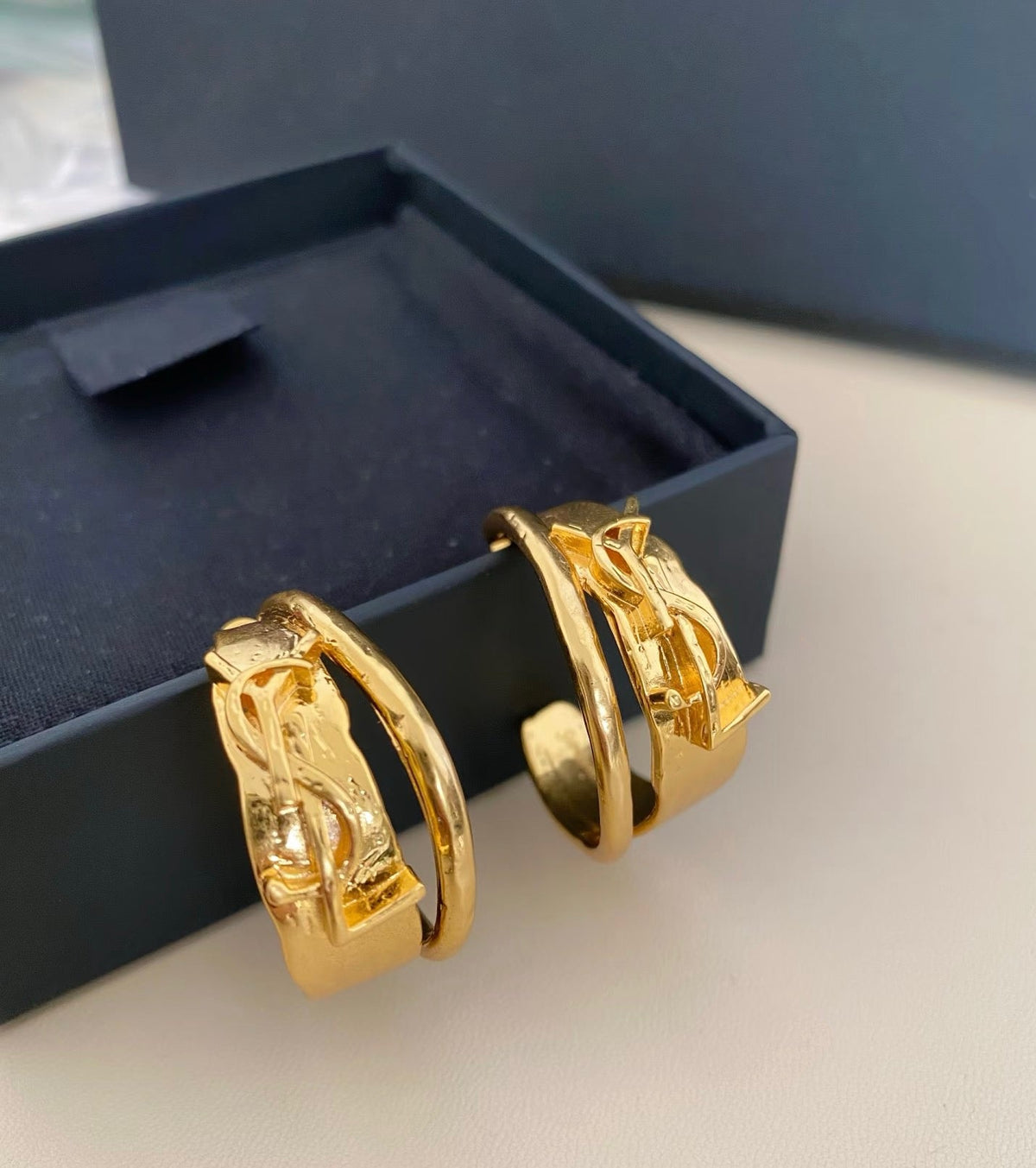Martin Graham earrings in polished metal-tone – detail view