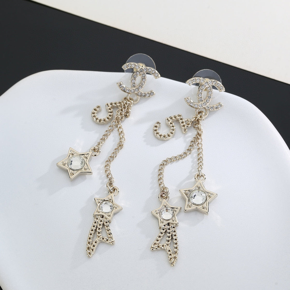 Martin Graham stud earrings in polished metal-tone – detail view