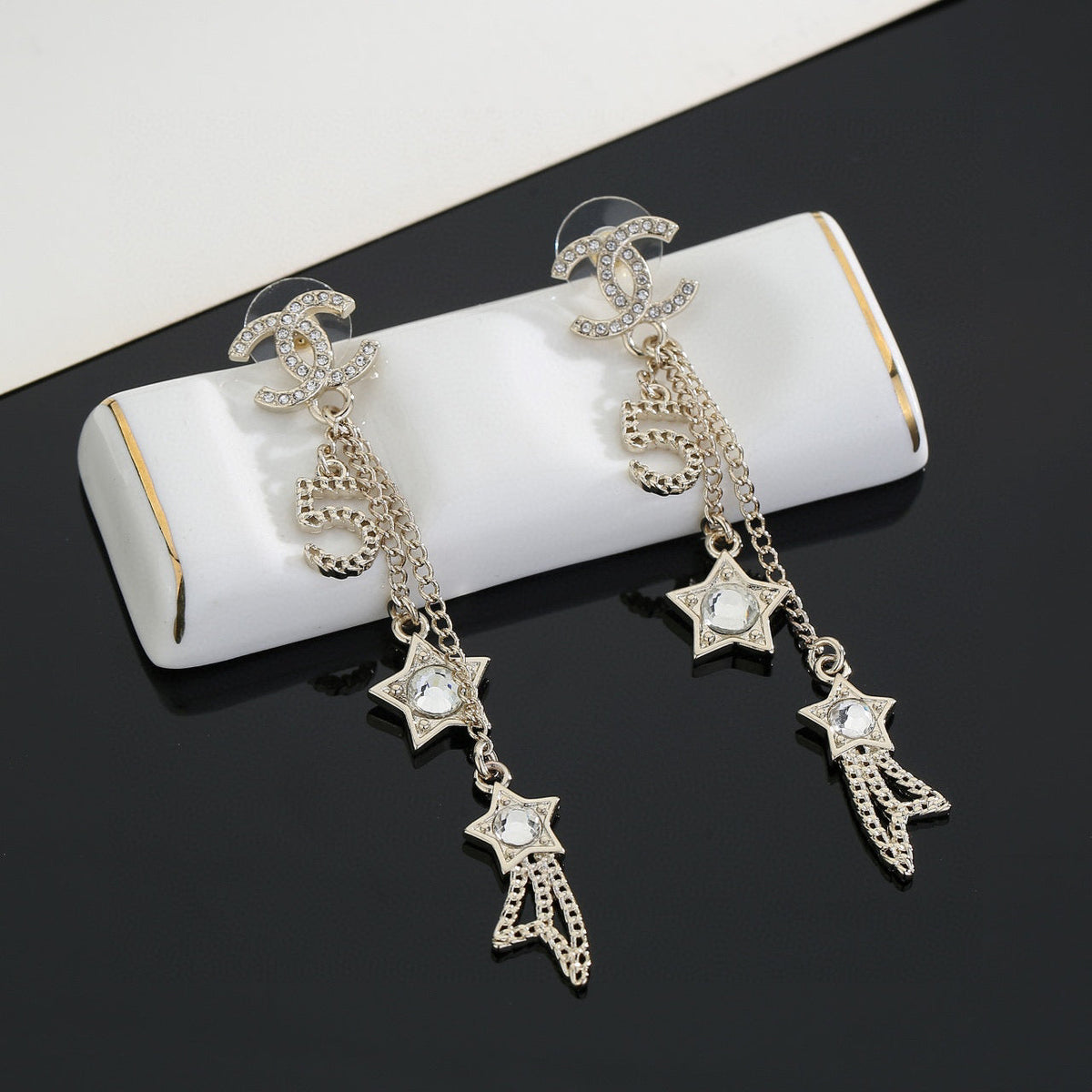Martin Graham stud earrings in polished metal-tone – front product view
