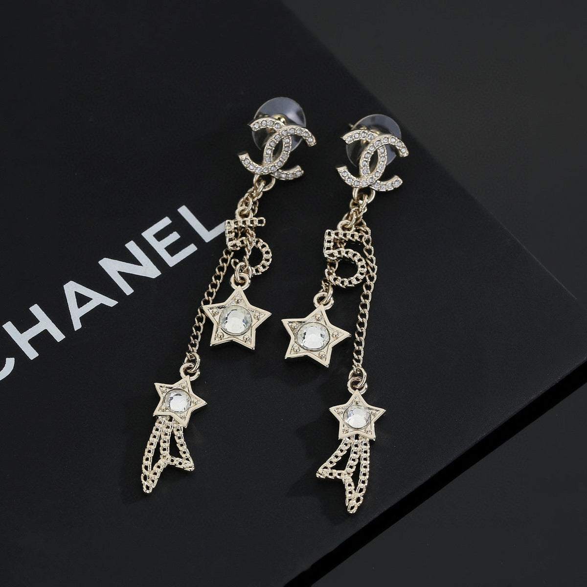 Martin Graham stud earrings in polished metal-tone – styled product view