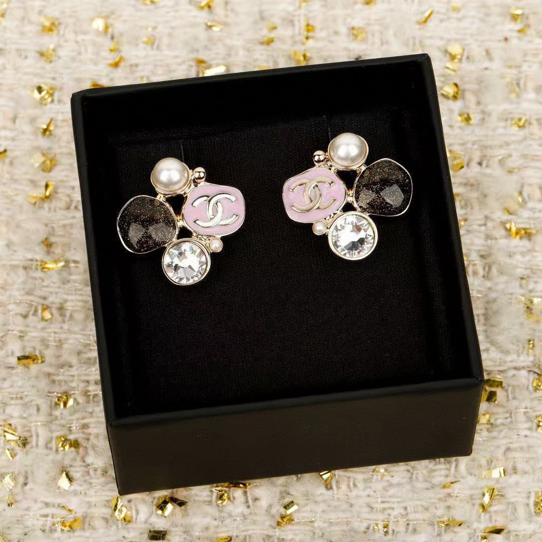 Martin Graham stud earrings in polished metal-tone – close-up detail