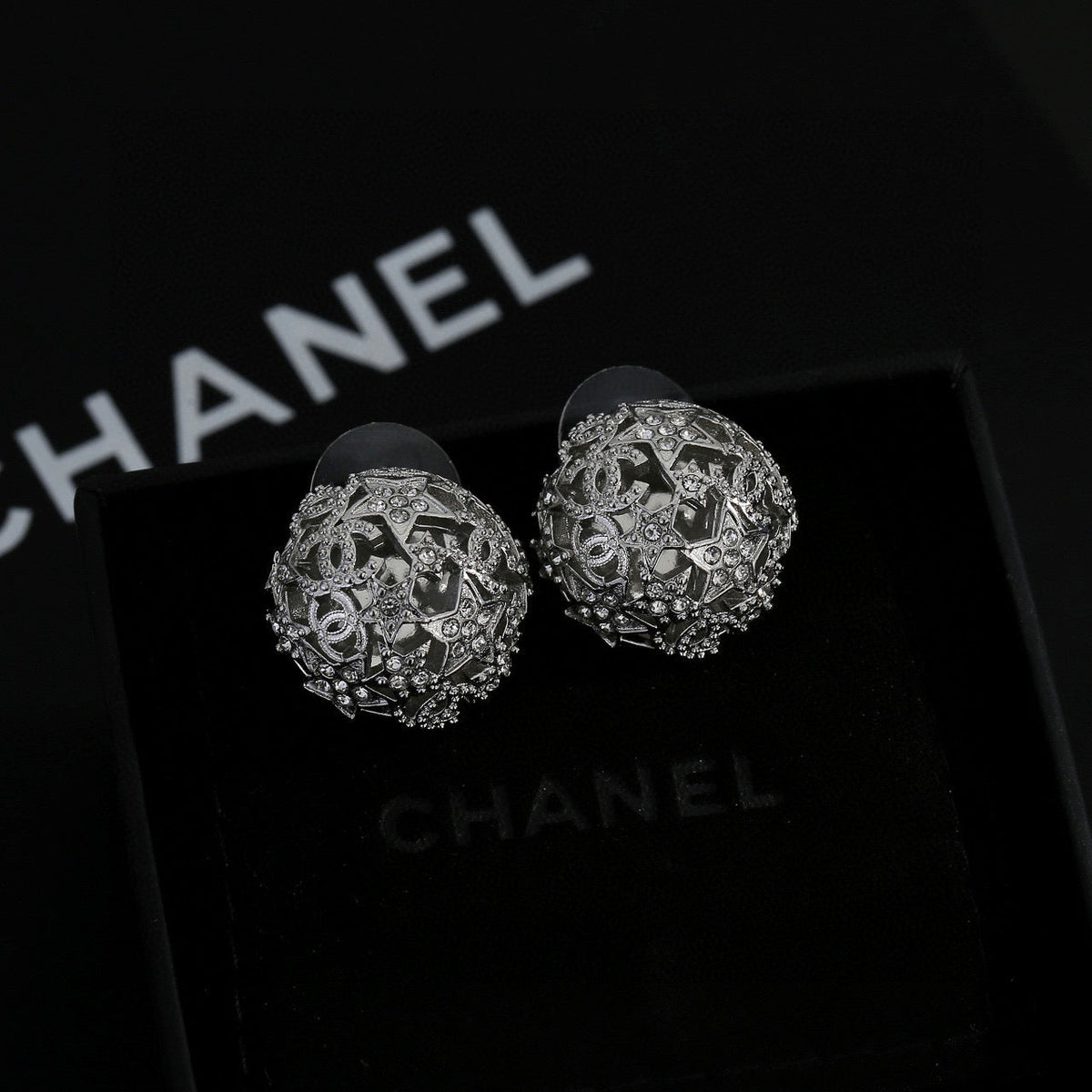 Martin Graham stud earrings in polished metal-tone – styled product view