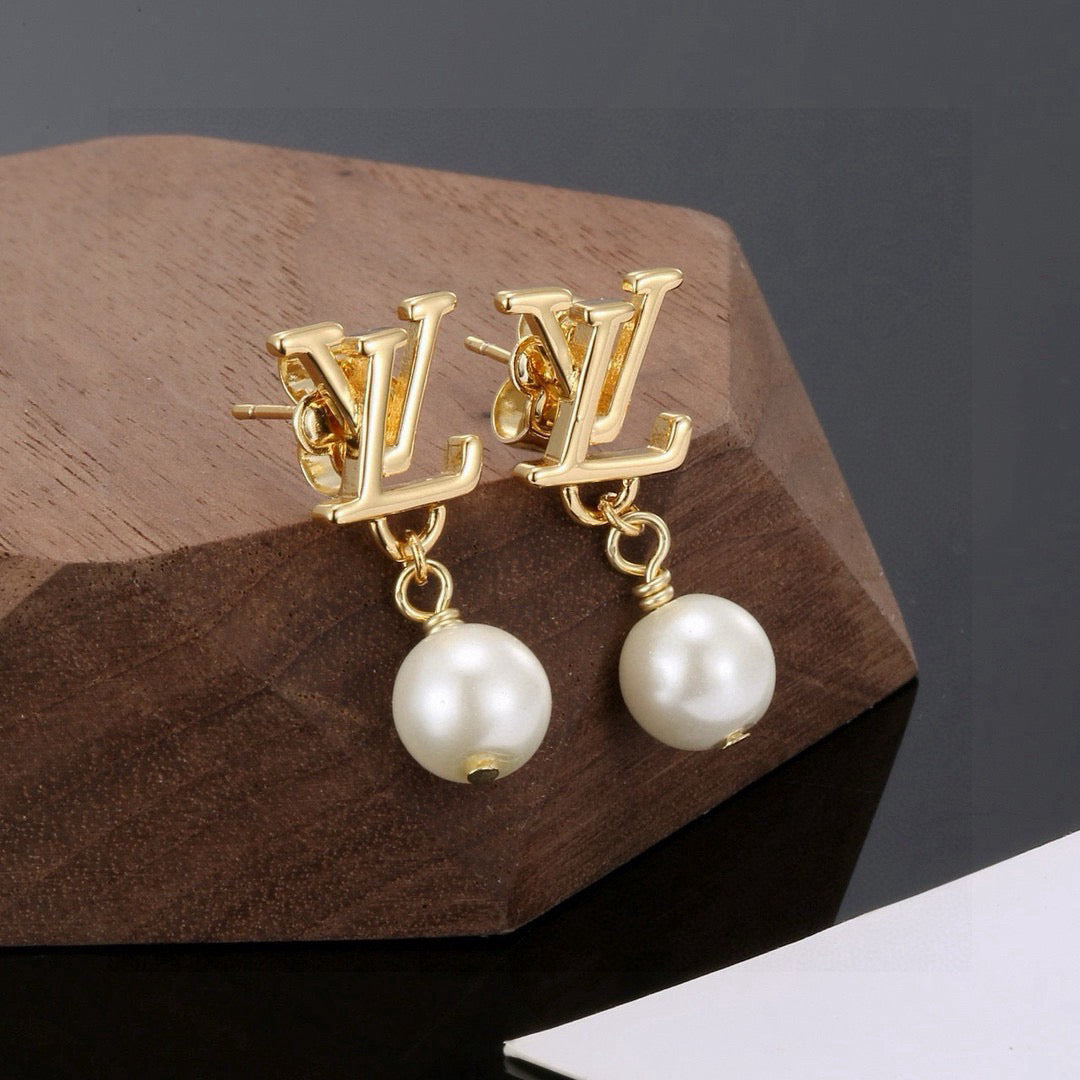 Martin Graham stud earrings in polished metal-tone – close-up detail