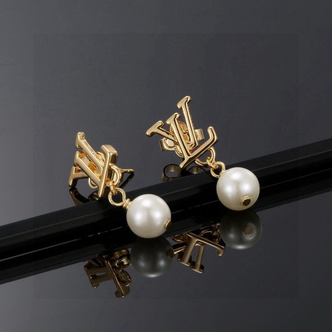 Martin Graham stud earrings in polished metal-tone – detail view
