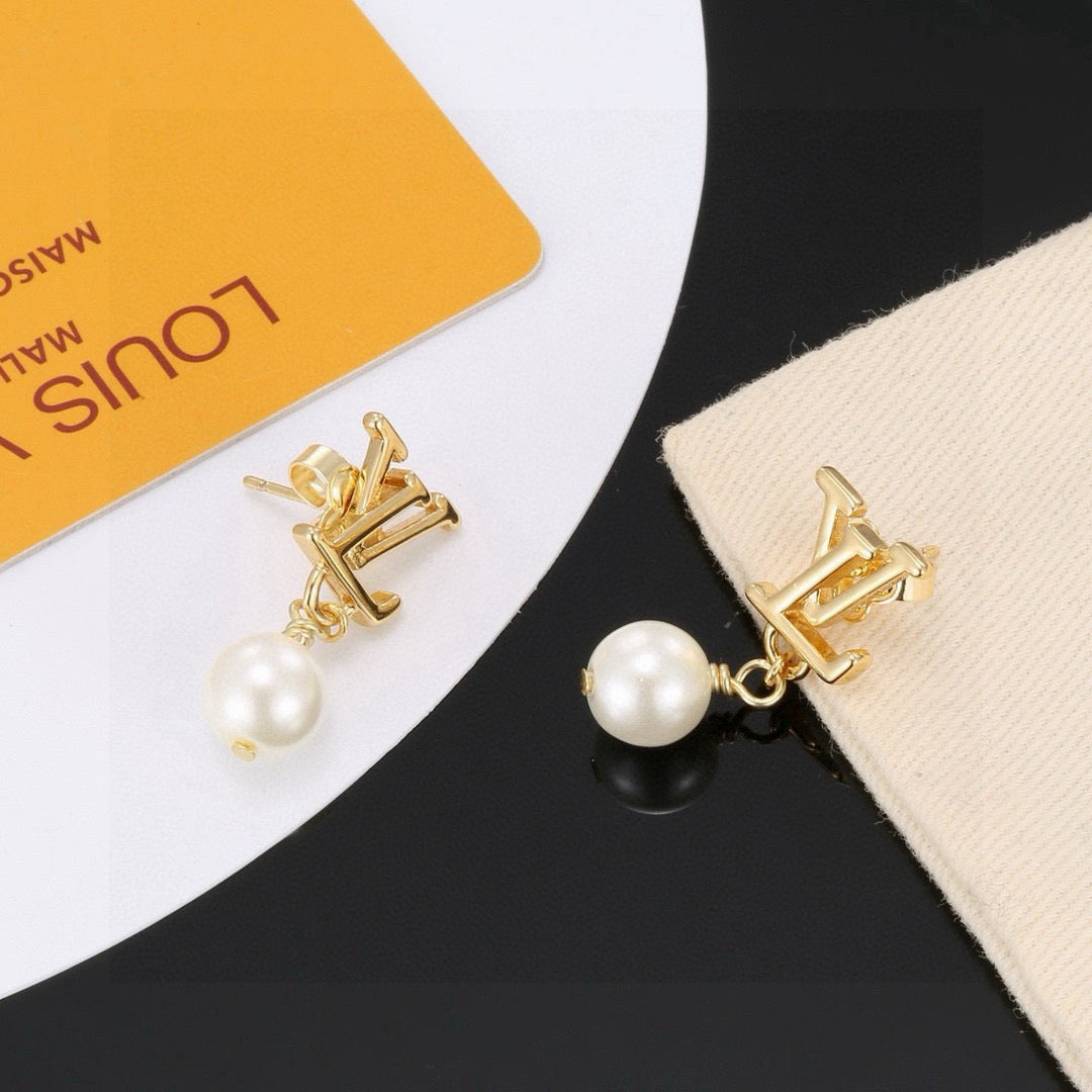 Martin Graham stud earrings in polished metal-tone – side detail